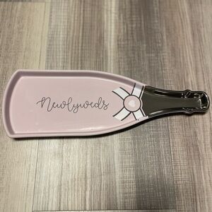 Newlyweds Champagne Bottle, Pink and Silver with Cursive Writing.